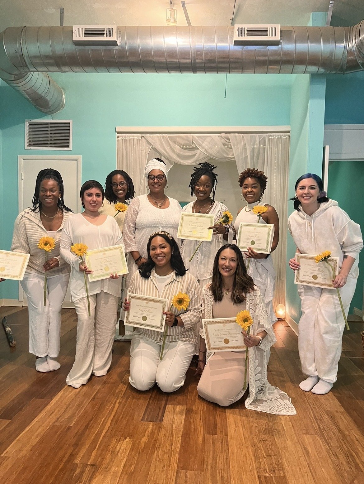 Bloom Sound Healer Training graduates holding certificates